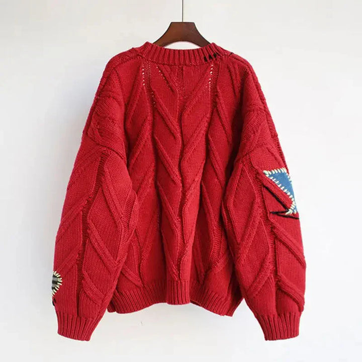 Damski sweter z golfem i haftem patchwork
