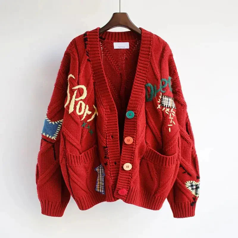 Damski sweter z golfem i haftem patchwork